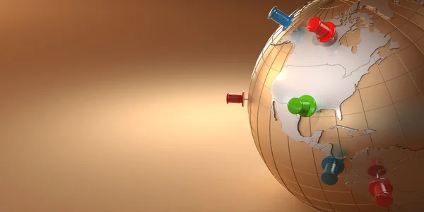 Dünya ve turuncu zemin üzerine raptiye — Stok fotoğraf