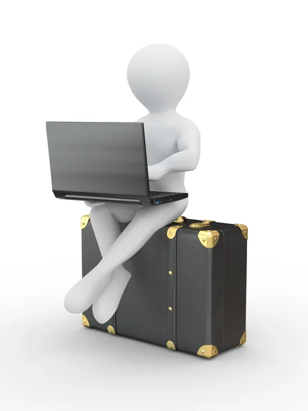 Uomo con computer portatile sul bagaglio — Foto Stock