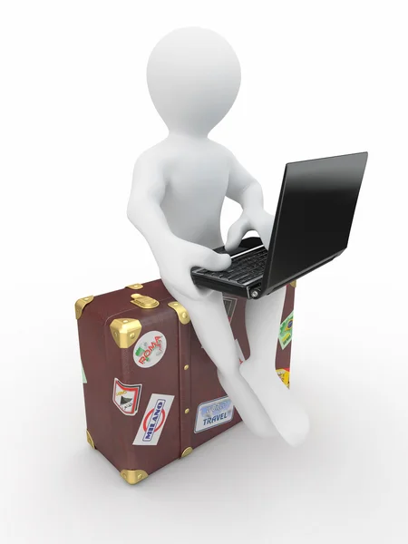 Man with laptop on the luggage — Stock Photo, Image