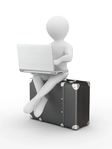 Uomo con computer portatile sul bagaglio — Foto Stock