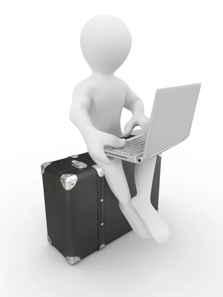 Man with laptop on the luggage — Stock Photo, Image