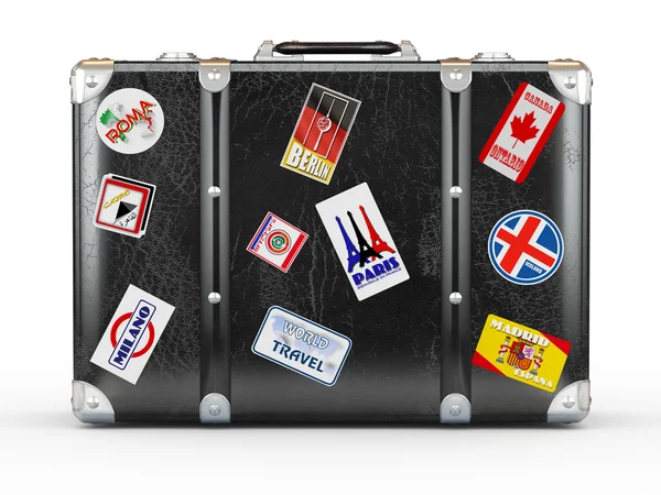 Black leather suitcase with travel stickers. — Stock Photo, Image