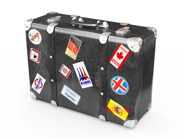 Чорна шкіряна валіза з наклейками для подорожей . — стокове фото