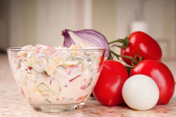 stock image Fresh vegetable salad dressed with sour cream.