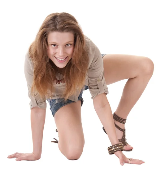 Happy teenager girl sitting on the floor — Stock Photo, Image
