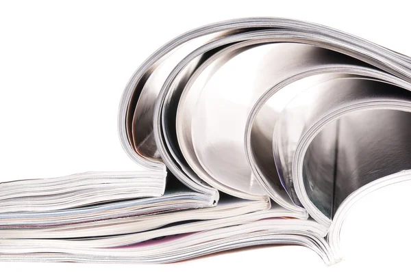 stock image Pile of magazines with bending pages