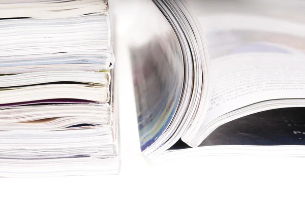 stock image Pile of magazines with bending pages