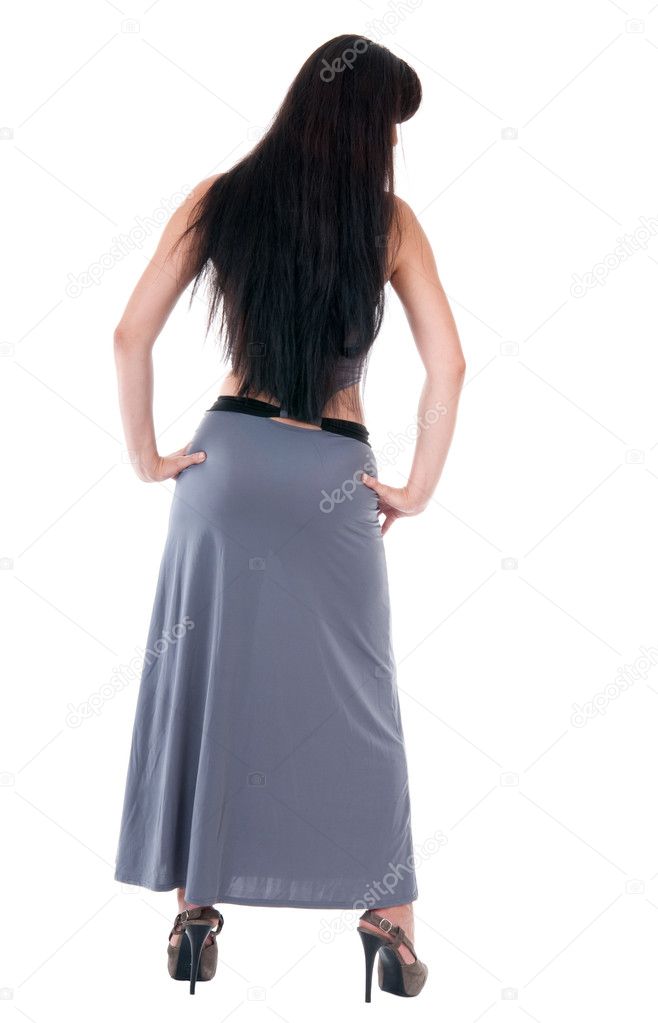 Woman in evening dress and high heels from back