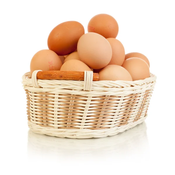 stock image Eggs in basket isolated on white