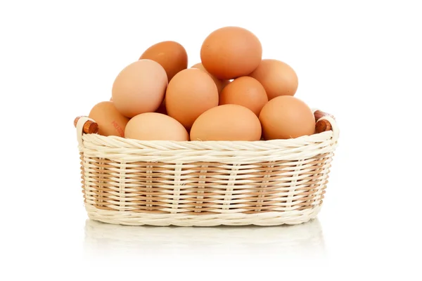 stock image Eggs in basket isolated on white