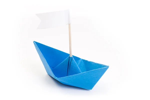 Papper kék origami hajó zászló — Stock Fotó
