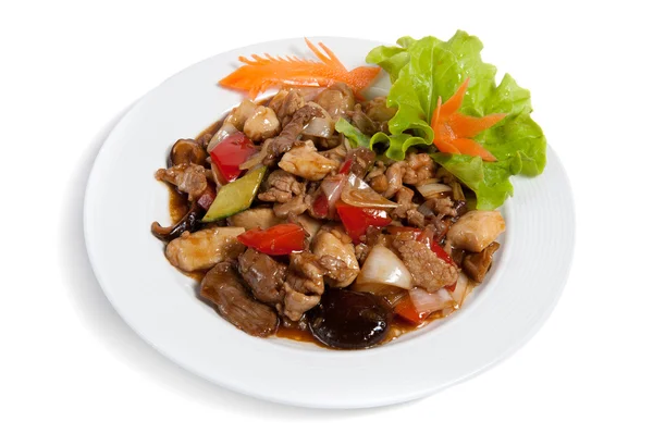 stock image Roasted meat with vegetables on a plate