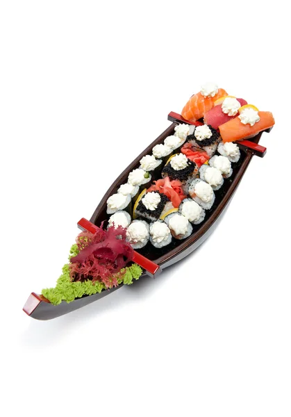 Set of sushi on wooden stand in the form of the boat — Stock Photo, Image
