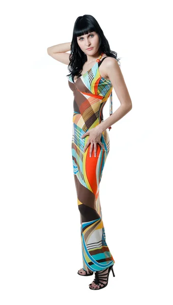Mädchen im abstrakten farbigen Kleid — Stockfoto
