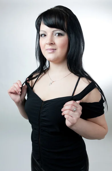 Plump girl in black dress — Stock Photo, Image