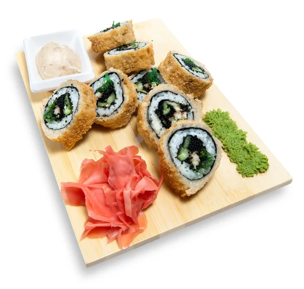 Sushi laminado en soporte de madera —  Fotos de Stock