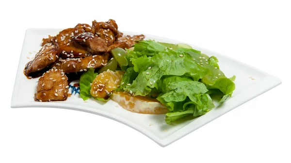 Pieces of chicken in sauce with salad — Stock Photo, Image