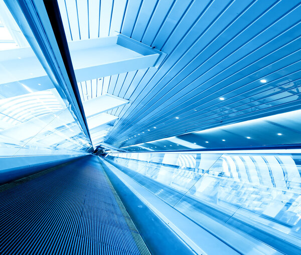 Blue escalator in motion