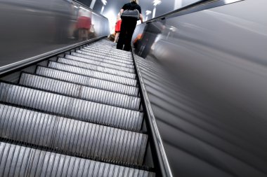 Diminishing escalator in metro clipart