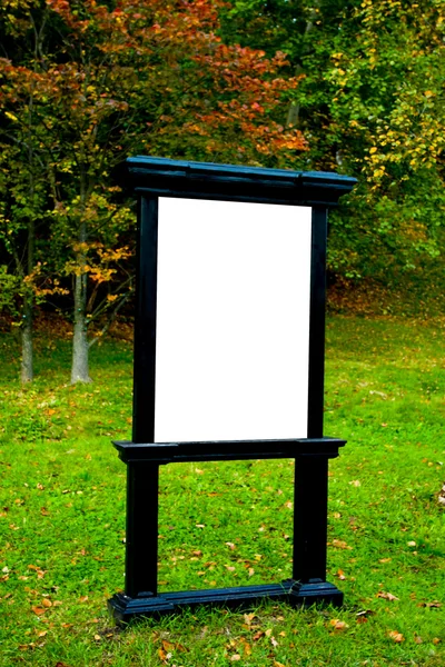 Rectangular big blank billboarb in autumn park — Zdjęcie stockowe
