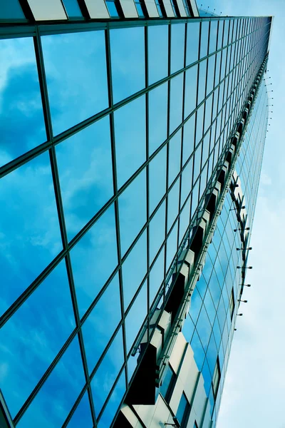 Modern green glass skyscraper perspective view — Stock Photo, Image