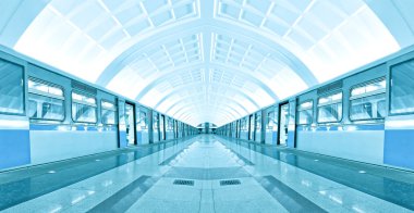 Symmetric illuminated metro station with marble floor clipart