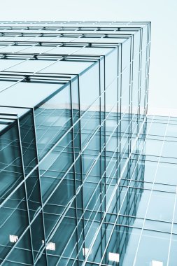 Transparent glass wall with blank placard of skyscraper