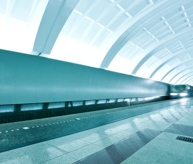 Wide angle view of modern metro station with train motion clipart