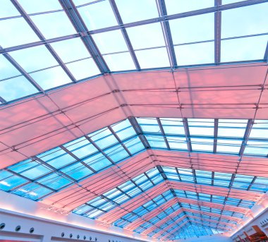 Colorful transparent ceiling inside contemporary airport clipart