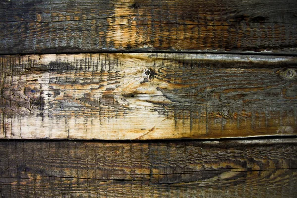 Planches de clôture en bois noir — Photo