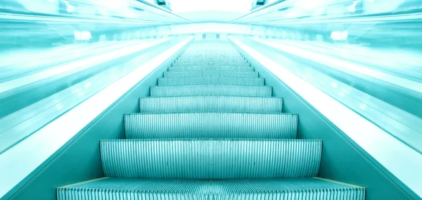 Escalera mecánica azul en movimiento —  Fotos de Stock