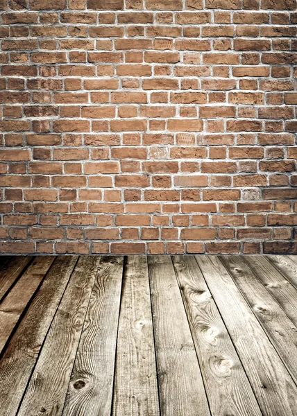 Red brick wall and wooden floor, rural interior — Stock Photo, Image