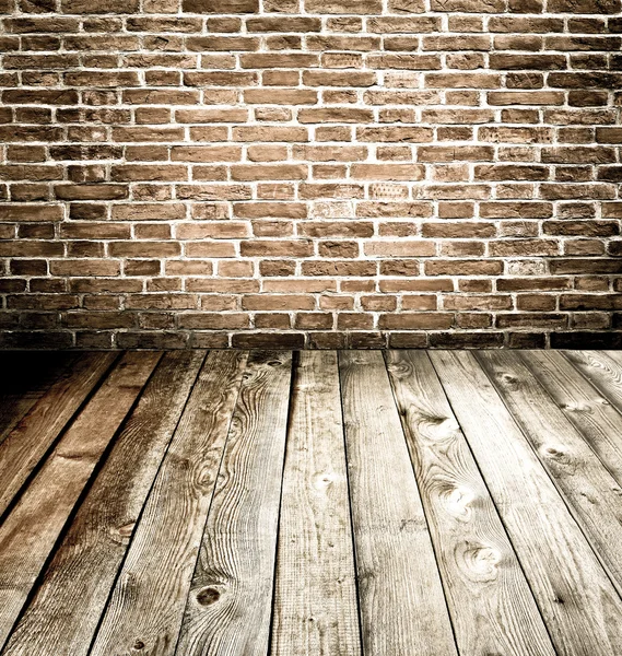 Абстрактные кирпичные стены и деревянный пол — стоковое фото