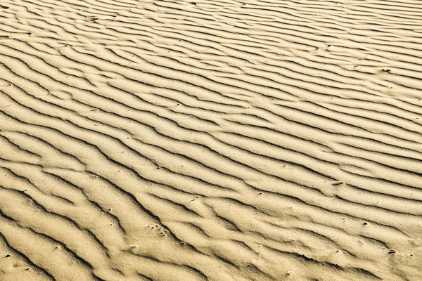 Gebobbeld textuur van zand strand — Stockfoto