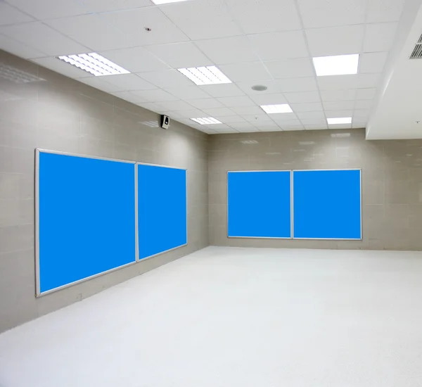 Modern hall with blue placards — Stock Photo, Image