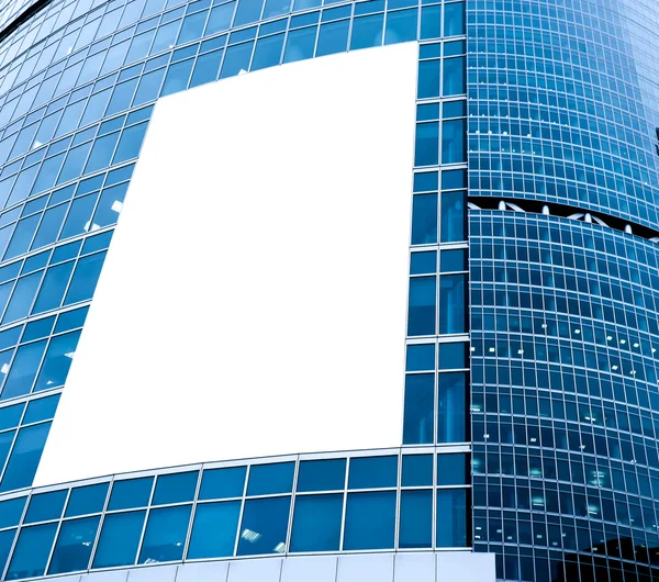 Blue glass wall with blank placard of skyscraper — Stock Photo, Image