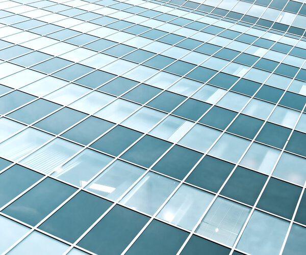 Blue transparent textured wall of glass skyscraper in business center