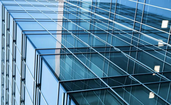 Transparent glass wall with blank placard of skyscraper — Stock Photo, Image