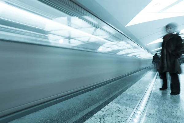 Modern illuminated metro station with train motion — Stock Photo, Image