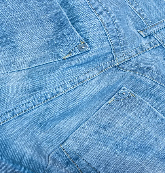 Zadní modré džíny obchodní zázemí — Stock fotografie
