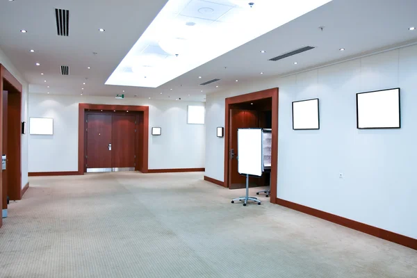 Modern hall with white placards — Stock Photo, Image