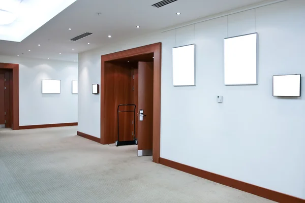 Modern hall with white placards — Stock Photo, Image