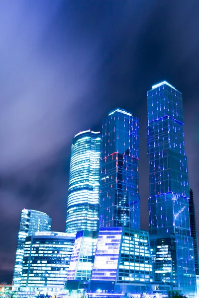 Contemporary construction of illuminated office glass skyscraper — Stock Photo, Image