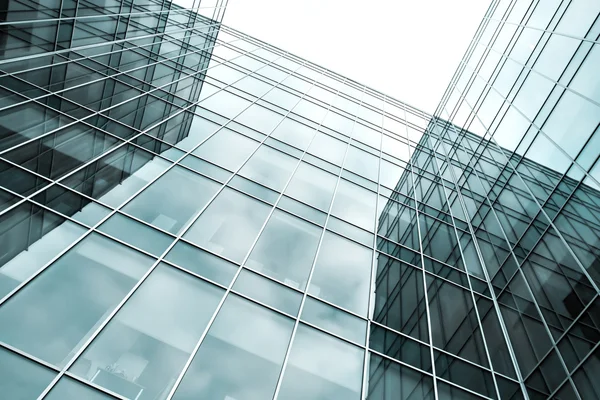 Modern blue glass skyscraper perspective view — Stock Photo, Image