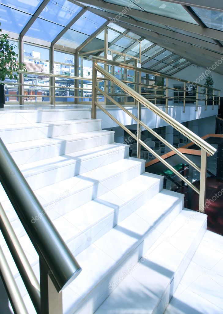White marble steps of the perfect business staircase in office center
