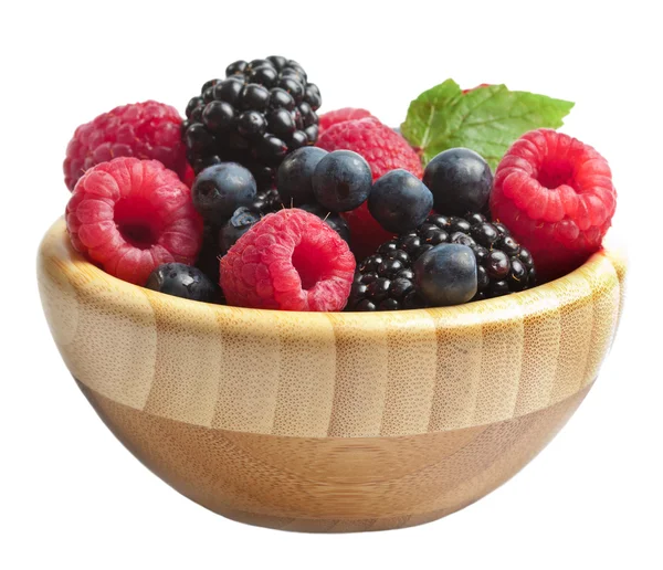 Berries in wood bowl isolated — Stok fotoğraf