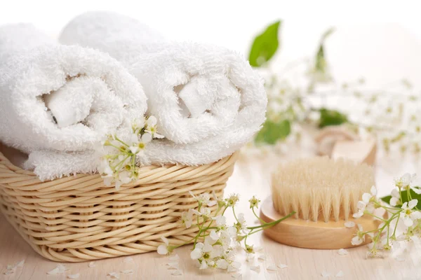 Towels flowers and massage brush — Stock Photo, Image