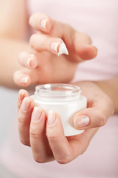 Beautiful woman hands with cream — Stock Photo, Image