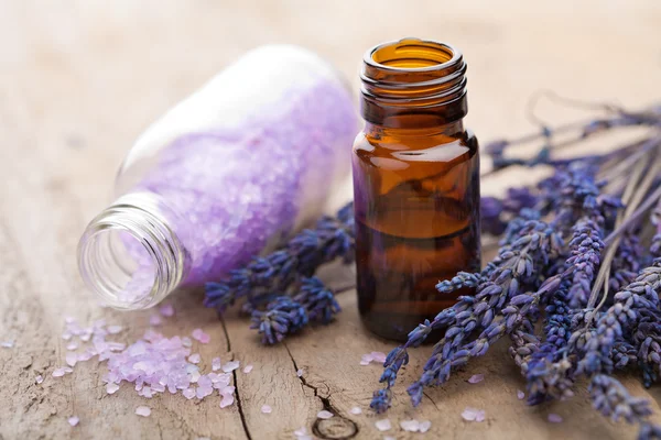 Essential oil and lavender flowers — Stock Photo, Image