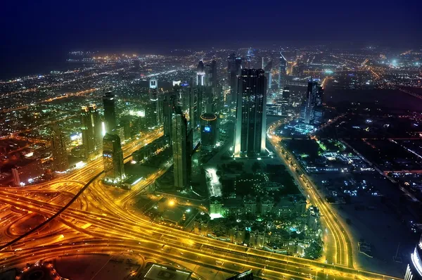 Panorama Dubai city at night. Stock Photo